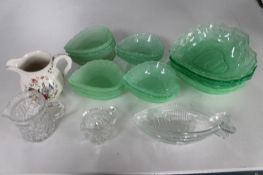 A tray of coloured green glass dishes etc