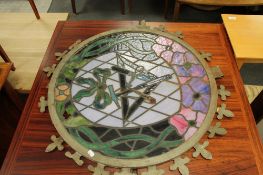 A leaded glazed window panel with metal frame