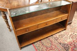 A teak side cabinet fitted with three drawers