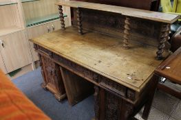 A nineteenth century carved oak desk