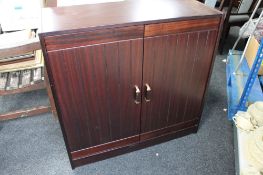 A mahogany double door cabinet