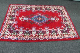 A woollen carpet of floral design,