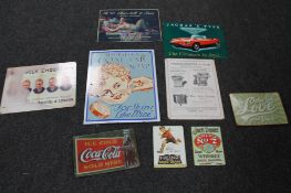 A collection of reproduction metal advertising signs