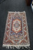 A Persian rug of geometric design,