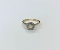 An antique 18ct gold opal and diamond cluster ring