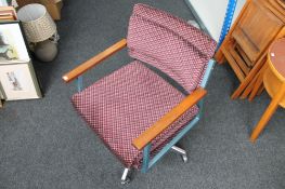 A mid 20th century metal framed swivel chair