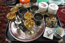 A collection of metal wares including a pair of brass elephant ornaments, two small brass bells,