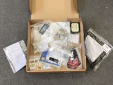 A box of a collection of military insignia, collector's cards,