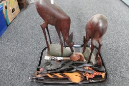 A tray of ornamental wooden eastern figures,