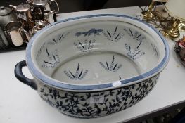A reproduction blue and white Staffordshire style foot bath