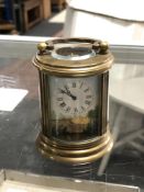 A brass enamelled French miniature carriage clock