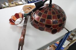 A vintage light fitting together with a mandolin