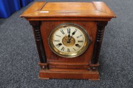 An Edwardian stained pine mantel clock