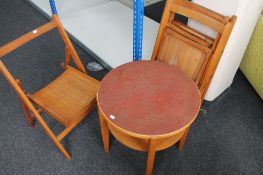 Four vintage folding chairs together with an occasional table