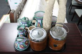 A tray of earthenware china, two oak biscuit barrels,