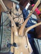 Three wooden frames with lighting attachments.