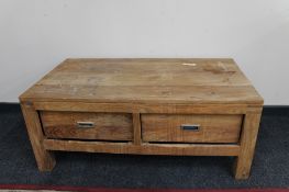A sheesham wood two drawer low table