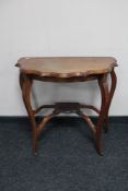 An Edwardian mahogany occasional table