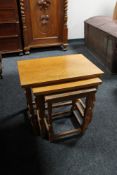 A nest of three light oak tables