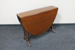 A Victorian inlaid mahogany drop leaf table