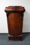A mahogany pedestal cabinet