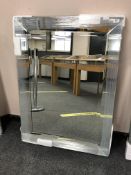 An all glass mitre corner mirror