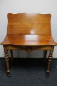 A nineteenth century walnut tea table