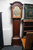 A nineteenth century mahogany longcased clock with brass and silvered dial