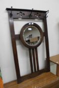 An oak framed hall mirror