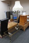 A brass and glass topped coffee table together with a brass standard lamp and shade