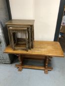 An oak coffee table and a nest of tables