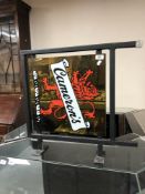 A metal Cameron's advertising sign