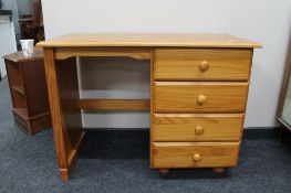 A pine dressing table fitted with four drawers