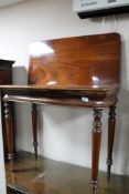 A nineteenth century mahogany tea table CONDITION REPORT: Two areas of damage to