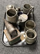 A tray of antique metal ware, pewter tankards,