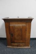 A nineteenth century walnut single door wall cabinet