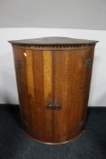 A George III oak corner cabinet