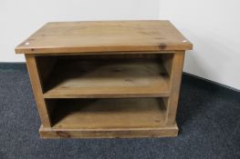 A pine two tier audio stand