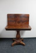 A nineteenth century mahogany turn over topped tea table