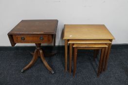 A nest of mahogany tables together with a small flap sided table