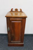 An Edwardian walnut pot cupboard