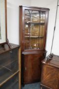 A mahogany display cabinet