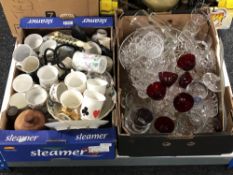 Two boxes of coloured and pressed glass,