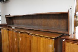 A large oak hanging bookshelf