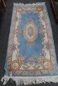 A blue fringed Chinese rug