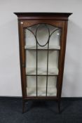 An Edwardian inlaid mahogany display cabinet