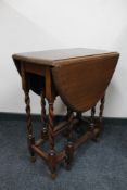 An oak gateleg table