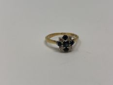 An 18ct gold sapphire and diamond ring, 2.2g.