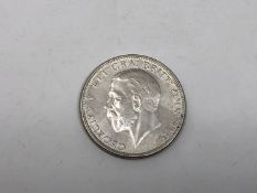 A 1928 one florin coin