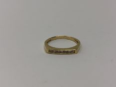 An 18ct gold seven stone diamond ring, approximately .4ct.